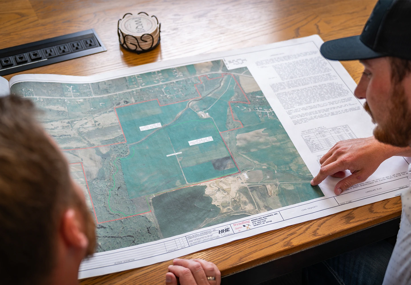 Wendling Quarries employees looking at a map of property